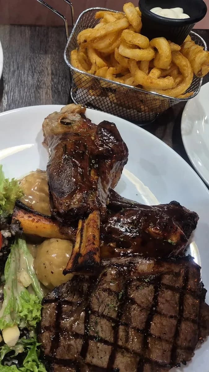 You enter a trendy room full of steak aromas