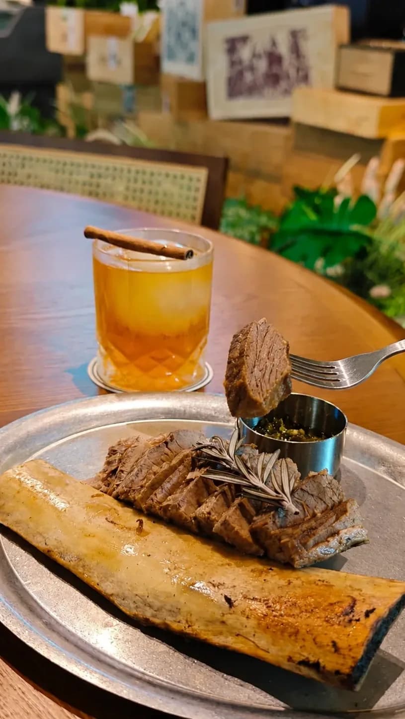 Walk into STEAKvME after dark