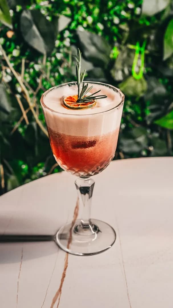 Sip cocktails in a cozy, dimly lit room photo 2