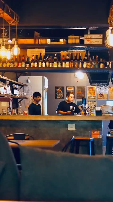 Spot a trendy bar serving local beers photo 2