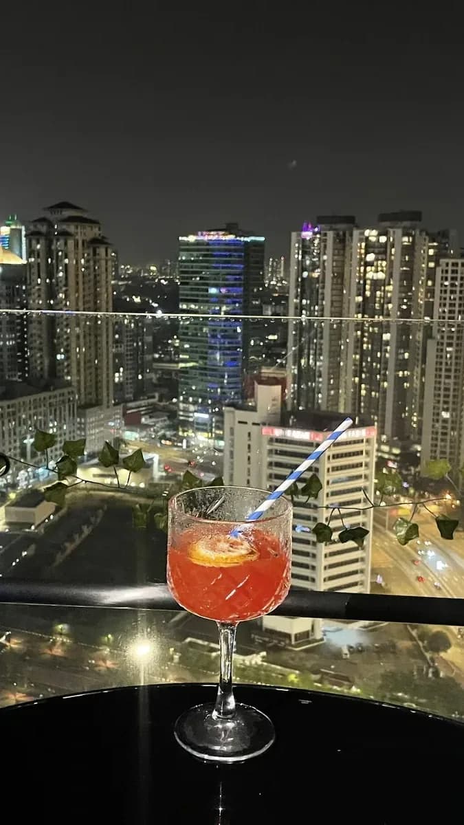 Catch city lights while sipping a cocktail