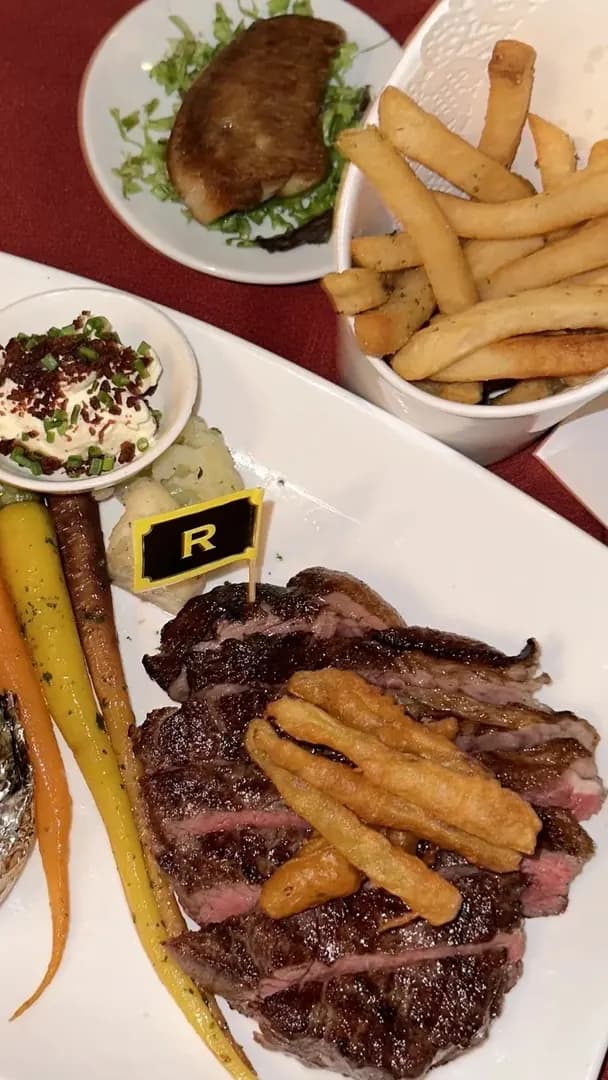 Share hearty steaks during dinner time photo 2